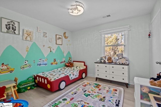 bedroom featuring hardwood / wood-style flooring