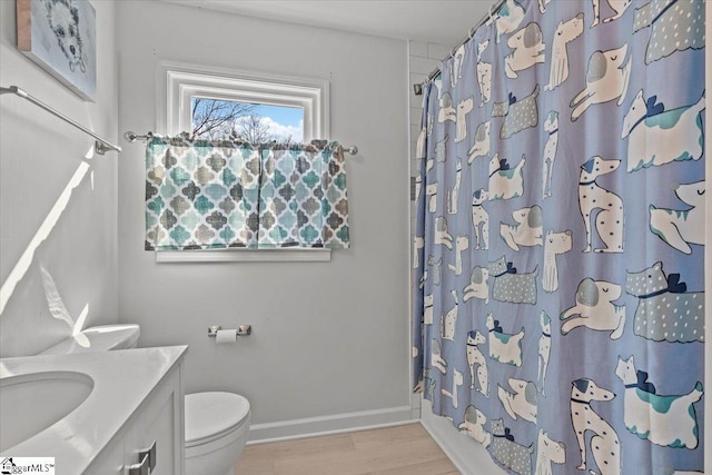 bathroom featuring hardwood / wood-style flooring, vanity, and toilet