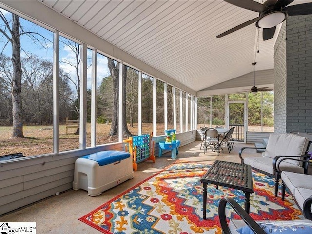 sunroom / solarium with vaulted ceiling and ceiling fan