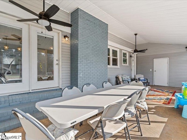 view of patio featuring an outdoor bar and ceiling fan