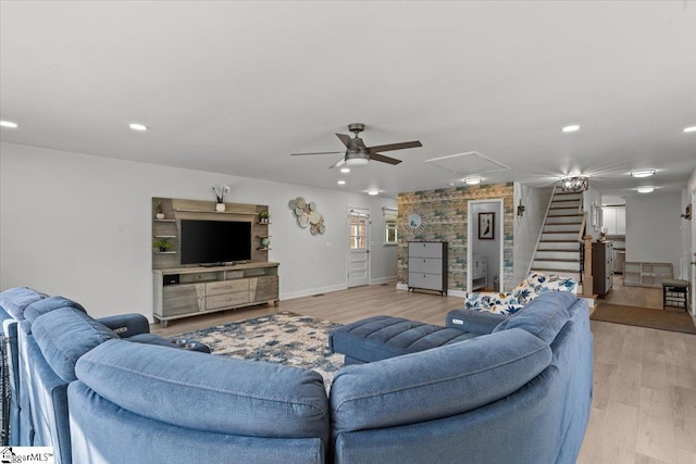 living room with ceiling fan and light hardwood / wood-style floors