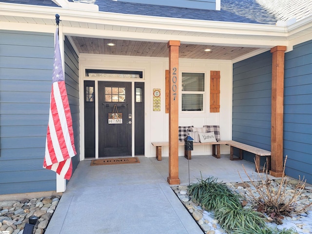 entrance to property featuring covered porch