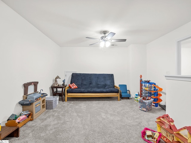 recreation room with carpet floors and ceiling fan