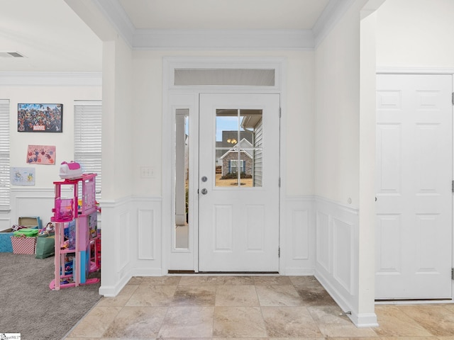 entryway featuring crown molding