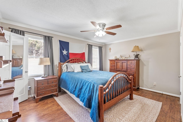 bedroom with multiple windows, hardwood / wood-style floors, and ornamental molding