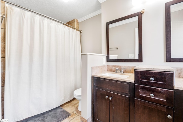 bathroom with vanity, crown molding, a textured ceiling, and toilet