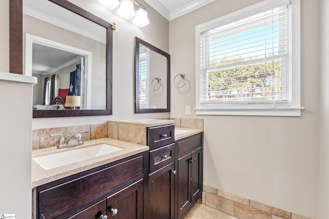 bathroom with crown molding and vanity