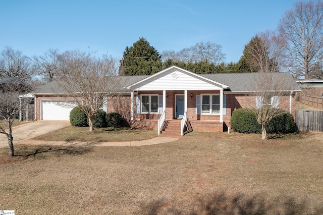 single story home featuring a porch, a garage, and a front yard