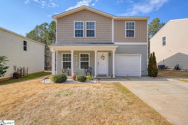 view of front of property featuring a garage, central AC, a front lawn, and covered porch