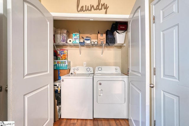 laundry room with hardwood / wood-style flooring and separate washer and dryer