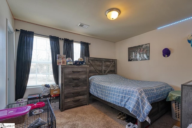 bedroom with light colored carpet