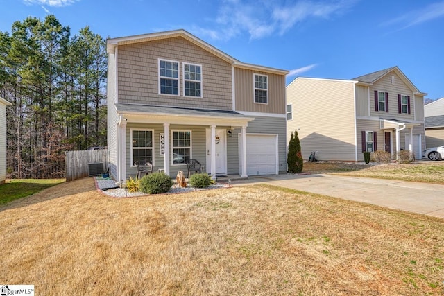 view of front facade featuring a garage, a front yard, central air condition unit, and a porch