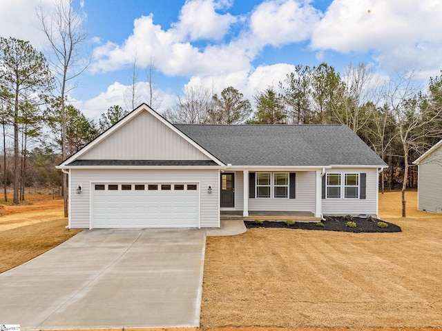 ranch-style house with a garage and a front lawn