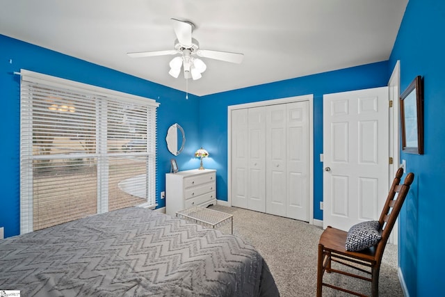 bedroom featuring ceiling fan, carpet, and a closet