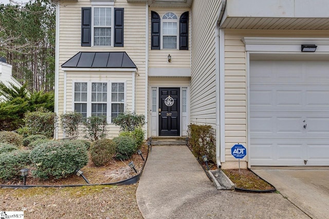 doorway to property featuring a garage