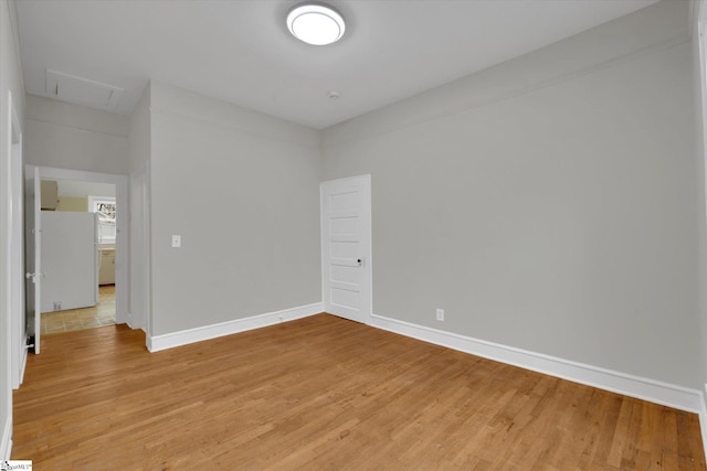 spare room with light hardwood / wood-style floors