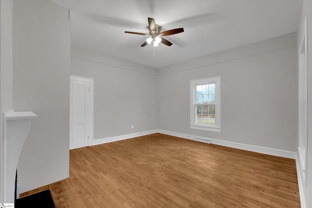 unfurnished room featuring ceiling fan and light wood-type flooring