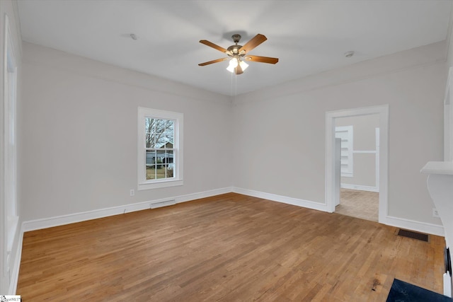 empty room with ceiling fan and light wood-type flooring