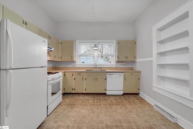 kitchen featuring white appliances, sink, and cream cabinetry