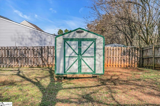 view of outdoor structure featuring a lawn