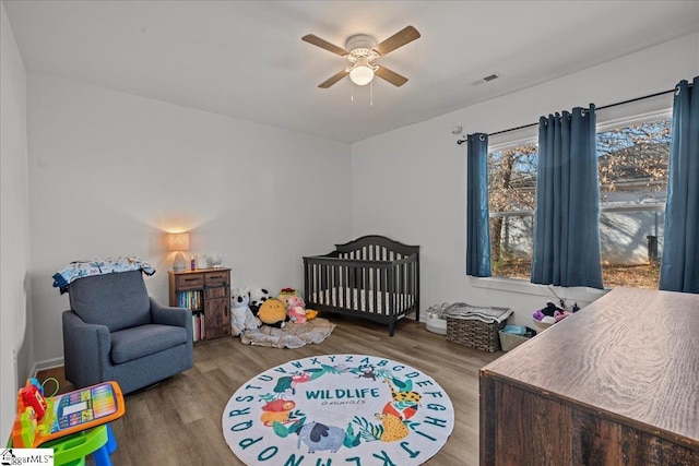 bedroom featuring wood-type flooring and ceiling fan