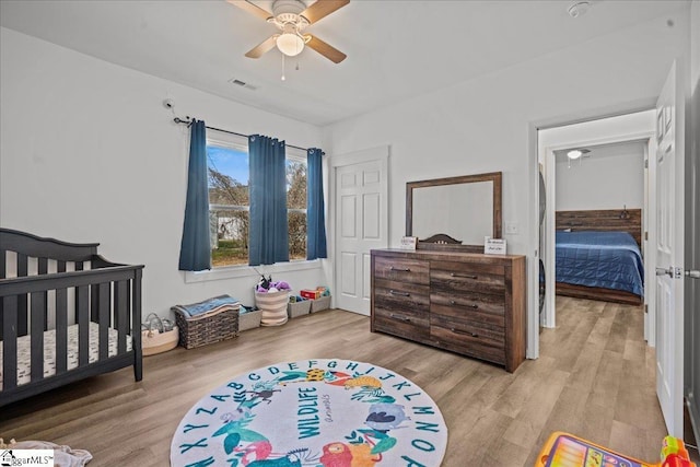 bedroom featuring ceiling fan and light hardwood / wood-style floors