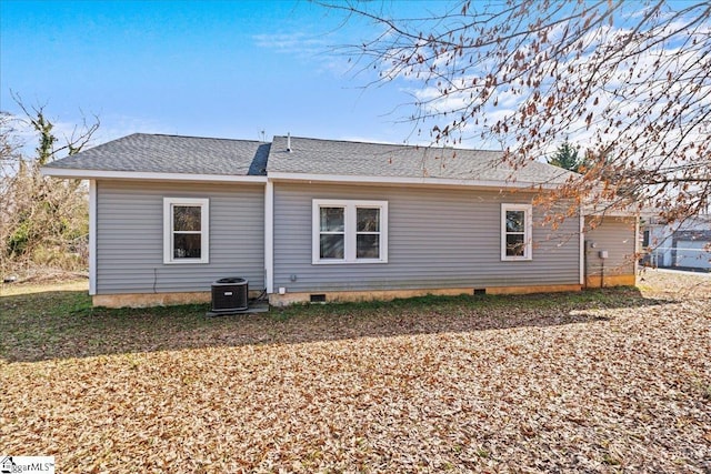 rear view of house featuring cooling unit