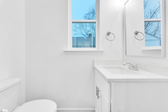 bathroom with vanity and toilet