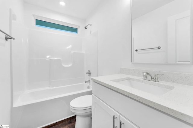 full bathroom featuring vanity, tub / shower combination, and toilet