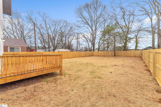 view of yard with a wooden deck