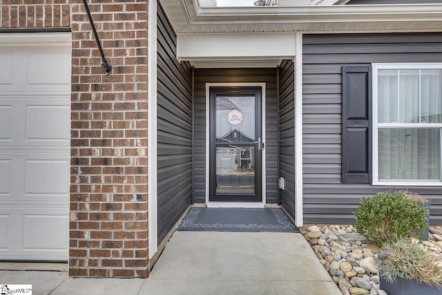 property entrance with a garage