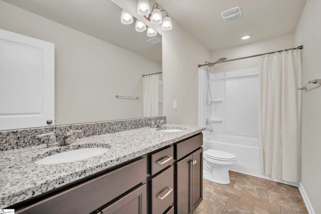 full bathroom with vanity, shower / bath combination with curtain, and toilet