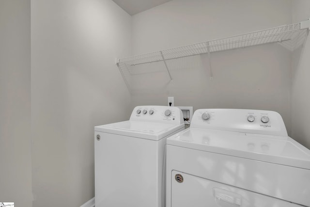 washroom featuring washing machine and dryer
