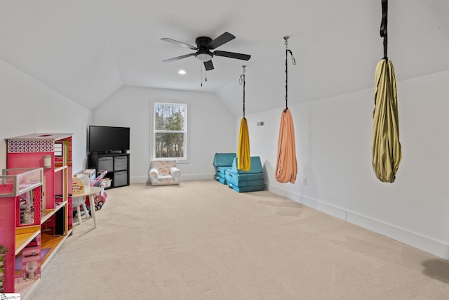 game room with ceiling fan, carpet flooring, and vaulted ceiling