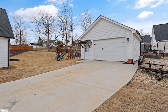 garage featuring a lawn