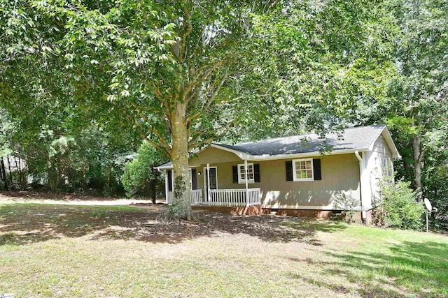 view of front facade with covered porch and a front lawn