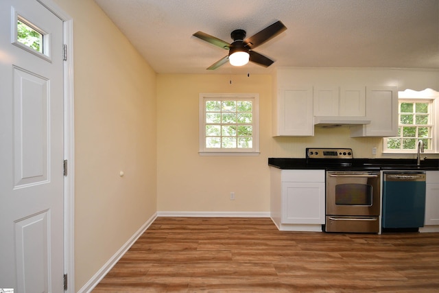 kitchen featuring ceiling fan, dishwasher, electric range, light hardwood / wood-style floors, and white cabinets