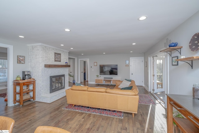 living room featuring hardwood / wood-style floors and a fireplace