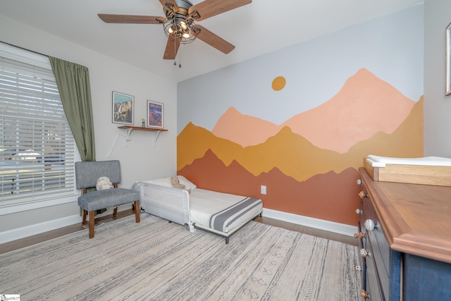 bedroom with hardwood / wood-style flooring and ceiling fan