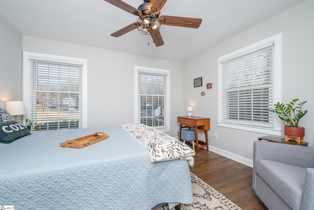 bedroom featuring dark wood-type flooring and ceiling fan