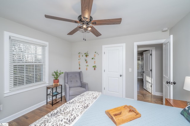 bedroom featuring dark wood-type flooring and ceiling fan