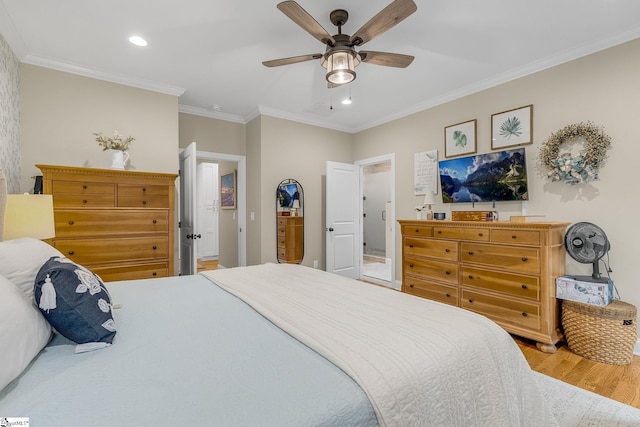 bedroom with hardwood / wood-style flooring, ceiling fan, and crown molding