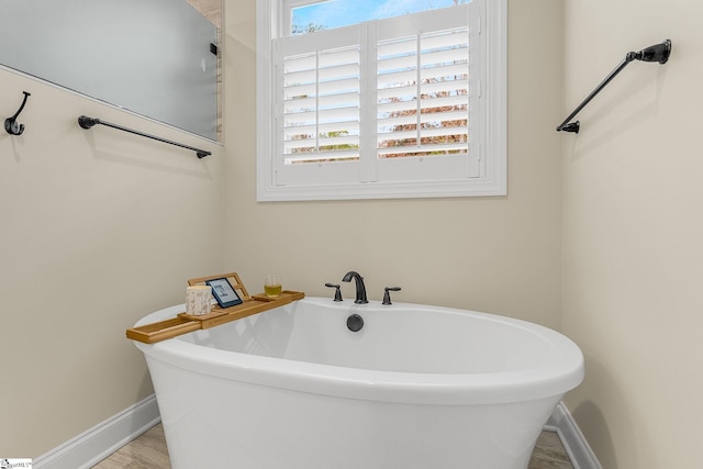 bathroom featuring a tub