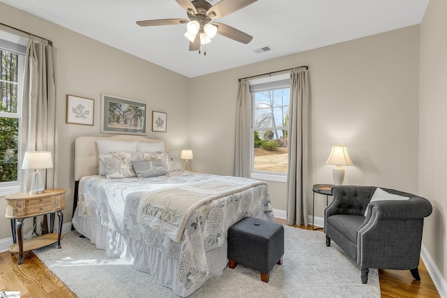 bedroom with ceiling fan and light wood-type flooring