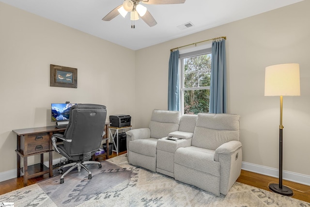 office area with hardwood / wood-style flooring and ceiling fan