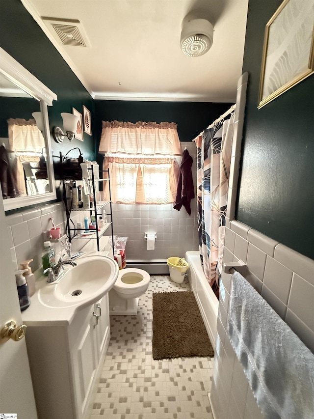 full bathroom featuring vanity, tile walls, shower / bath combo, and toilet