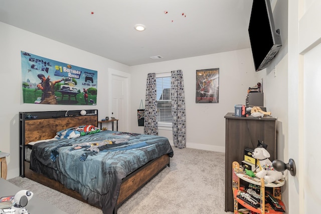 bedroom with light colored carpet