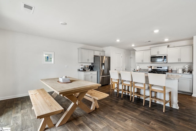 dining room featuring dark hardwood / wood-style flooring