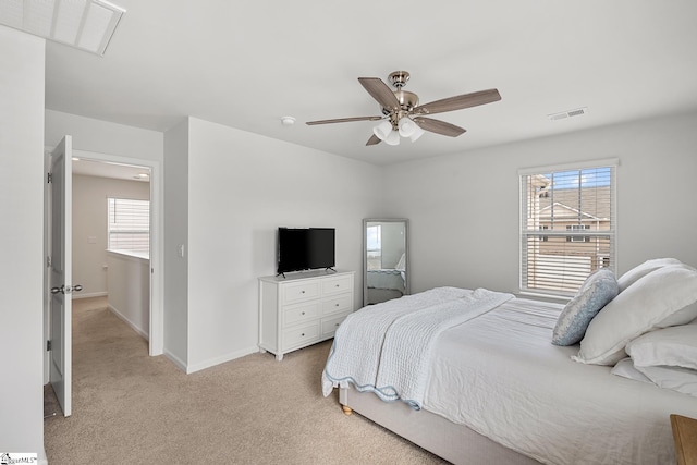 bedroom with light colored carpet and ceiling fan