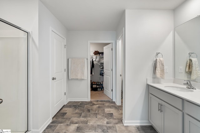 bathroom featuring vanity and walk in shower